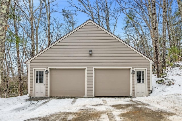 view of snow covered garage