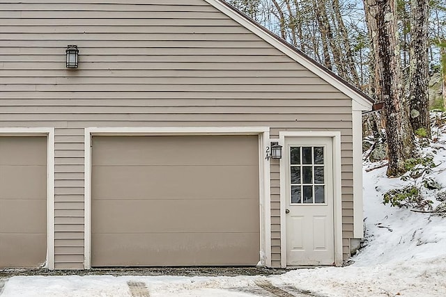 view of snow covered garage