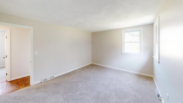 12 Sandra Ave, Burlington, MA 01803 - carpeted empty room with baseboards