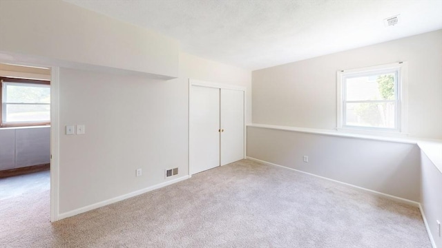 12 Sandra Ave, Burlington, MA 01803 - unfurnished bedroom with carpet floors, multiple windows, and a closet