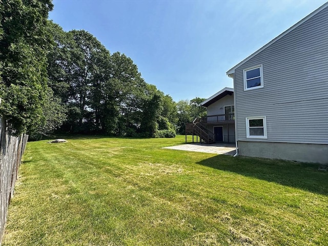 12 Sandra Ave, Burlington, MA 01803 - view of grassy yard featuring stairway, a patio, and a wooden deck