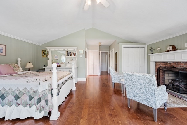 bedroom with ceiling fan, crown molding, vaulted ceiling, and dark hardwood / wood-style flooring