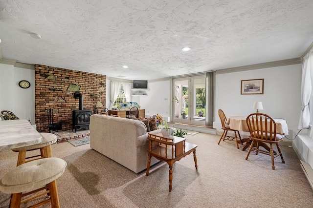 carpeted living room featuring a textured ceiling, ornamental molding, and a wood stove