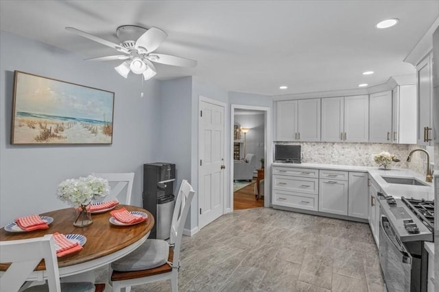 24 Stagecoach, Medfield, MA 02052 - kitchen featuring stainless steel gas stove, light countertops, ceiling fan, tasteful backsplash, and recessed lighting