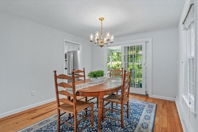 24 Stagecoach, Medfield, MA 02052 - dining space featuring a chandelier and light wood-style flooring
