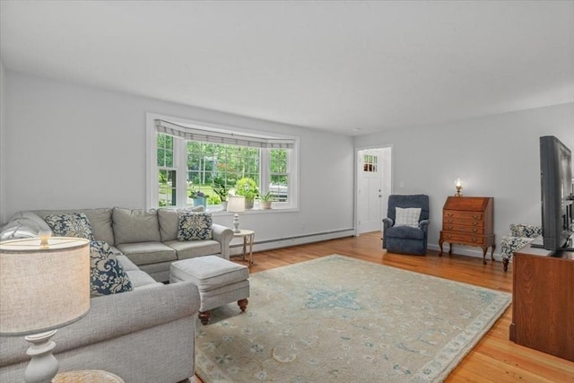 24 Stagecoach, Medfield, MA 02052 - living room featuring a baseboard heating unit and light wood-type flooring