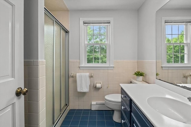 24 Stagecoach, Medfield, MA 02052 - bathroom with tile patterned floors, tile walls, baseboard heating, vanity, and a shower stall