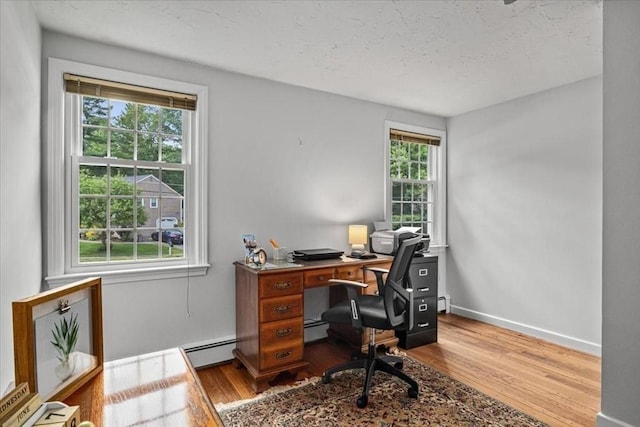 24 Stagecoach, Medfield, MA 02052 - office space featuring wood finished floors, plenty of natural light, a textured ceiling, and a baseboard radiator