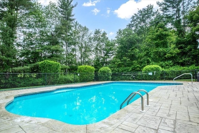 24 Stagecoach, Medfield, MA 02052 - view of swimming pool with a patio area and view of wooded area