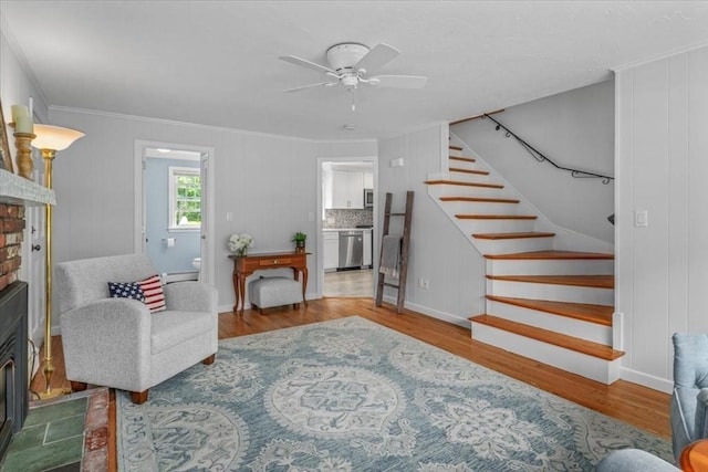 24 Stagecoach, Medfield, MA 02052 - living room with stairs, wood finished floors, crown molding, a fireplace, and ceiling fan