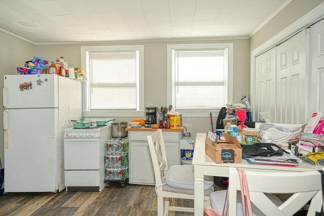 kitchen featuring white appliances, dark wood-style floors, and ornamental molding