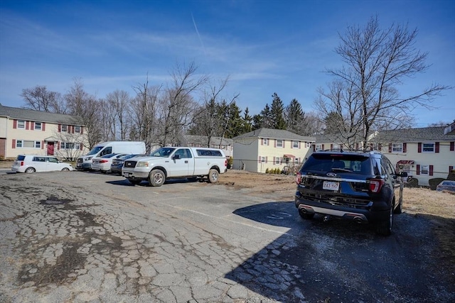 uncovered parking lot with a residential view