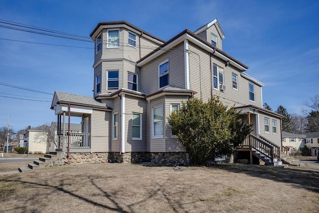 view of side of home featuring cooling unit