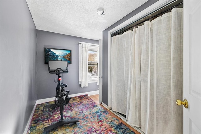 exercise area with a textured ceiling