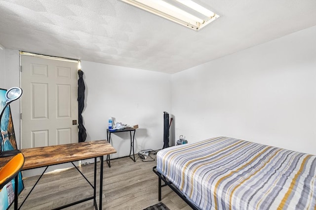 bedroom with light hardwood / wood-style floors