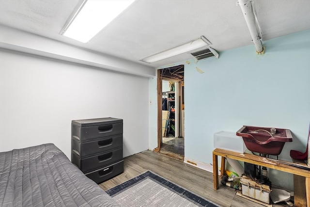 bedroom featuring hardwood / wood-style floors