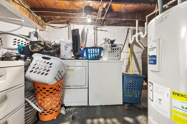 washroom with washer and clothes dryer and water heater