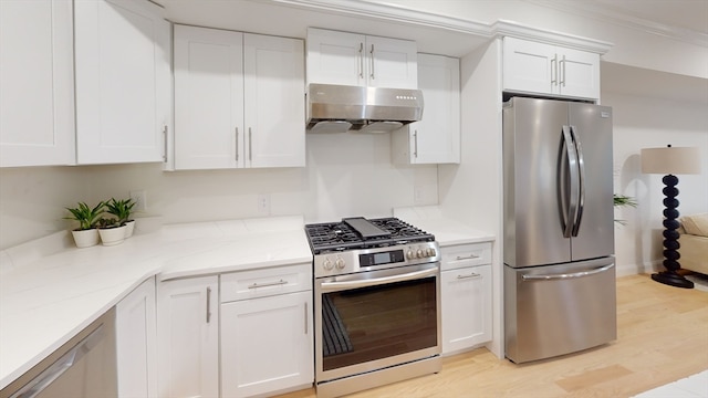 kitchen featuring white cabinetry, extractor fan, appliances with stainless steel finishes, and light wood-type flooring