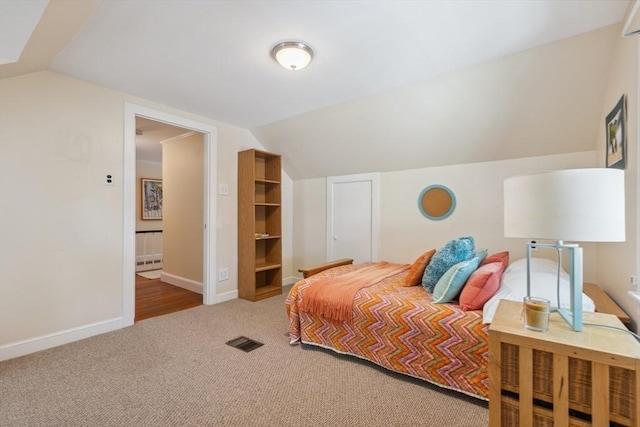 25 Piety Corner Rd, Waltham, MA 02451 - carpeted bedroom with vaulted ceiling, a baseboard heating unit, and baseboards
