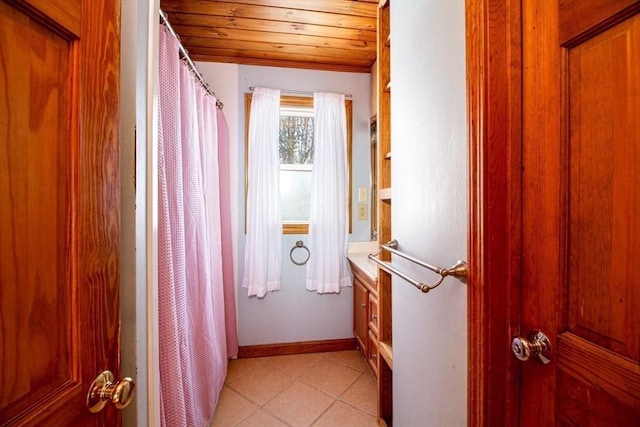 bathroom with tile patterned flooring, lofted ceiling, and wooden ceiling