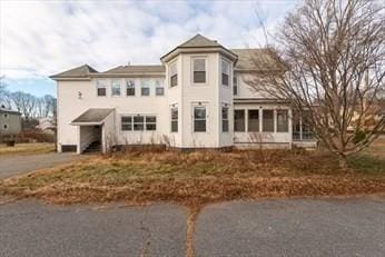 19 Chapel St, Shirley, MA 01464 - view of front of house featuring a sunroom and driveway