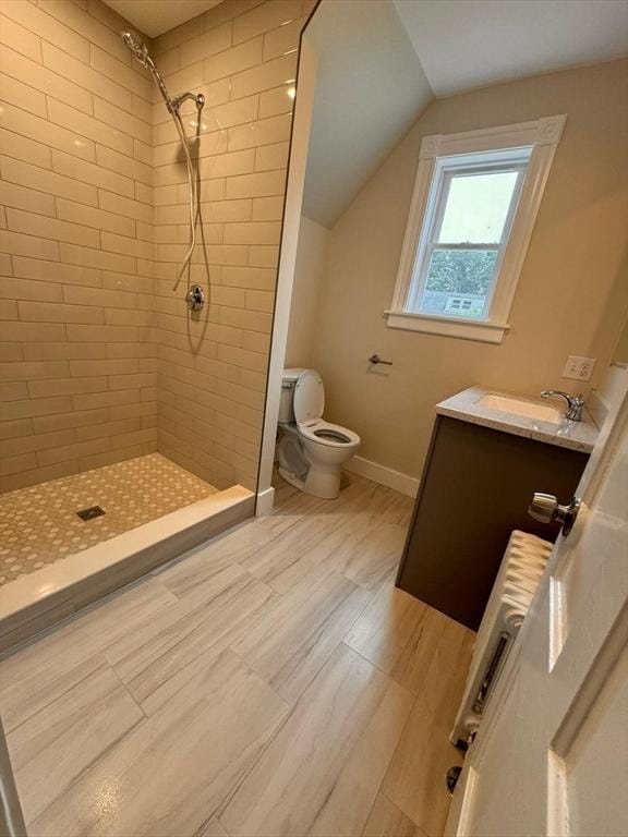 19 Chapel St, Shirley, MA 01464 - full bath featuring vanity, tiled shower, wood finished floors, lofted ceiling, and radiator heating unit