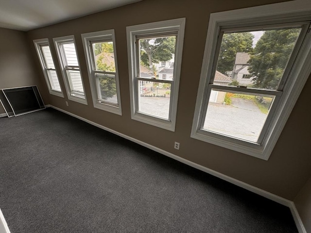 19 Chapel St, Shirley, MA 01464 - spare room featuring plenty of natural light and dark carpet