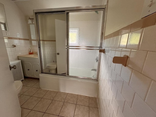 19 Chapel St, Shirley, MA 01464 - full bath featuring tile walls, tile patterned floors, vanity, wainscoting, and combined bath / shower with glass door