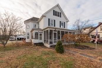 19 Chapel St, Shirley, MA 01464 - rear view of property with a sunroom
