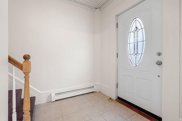 50 Howard St, Haverhill, MA 01830 - foyer entrance featuring a baseboard radiator, crown molding, light tile patterned floors, and stairway