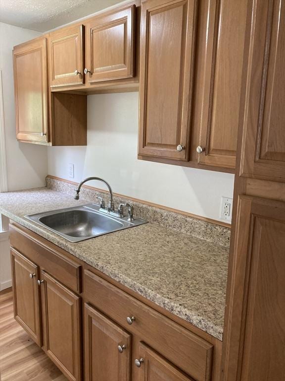 50 Howard St, Haverhill, MA 01830 - kitchen featuring light wood-type flooring and light countertops
