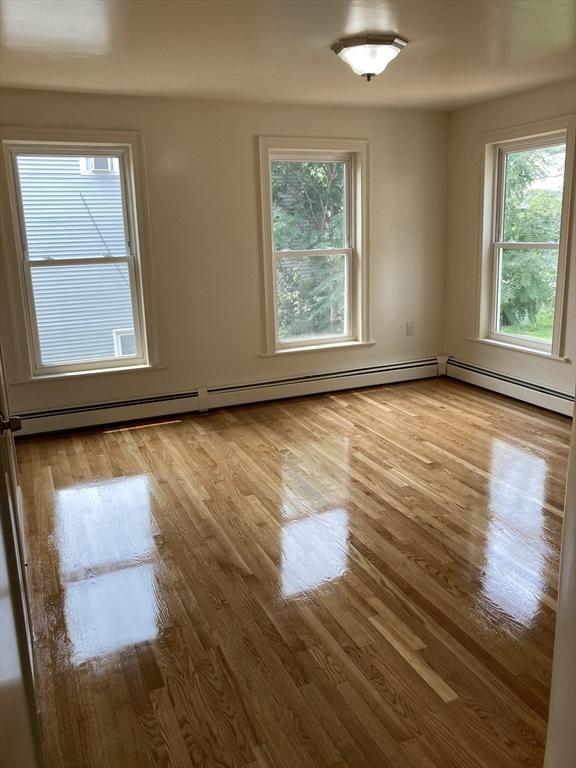 50 Howard St, Haverhill, MA 01830 - spare room featuring healthy amount of natural light and wood finished floors