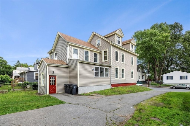 50 Howard St, Haverhill, MA 01830 - view of side of home with a lawn
