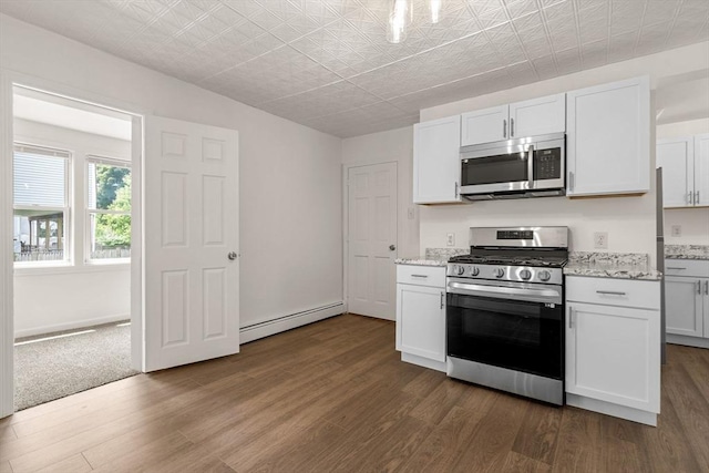 50 Howard St, Haverhill, MA 01830 - kitchen with stainless steel appliances, baseboard heating, dark wood finished floors, and white cabinets