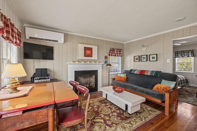 164 Kendrick Ave Unit 2 & 3, Wellfleet, MA 02667 - living room featuring ornamental molding, a wall unit AC, hardwood / wood-style floors, and a fireplace