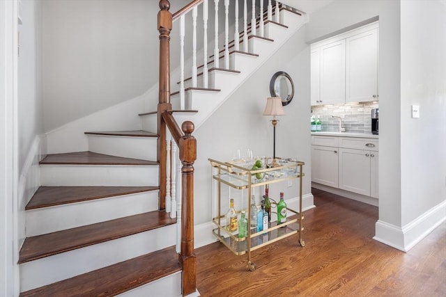 256 W Newton St Unit 1, Boston, MA 02116 - staircase featuring wood finished floors and baseboards
