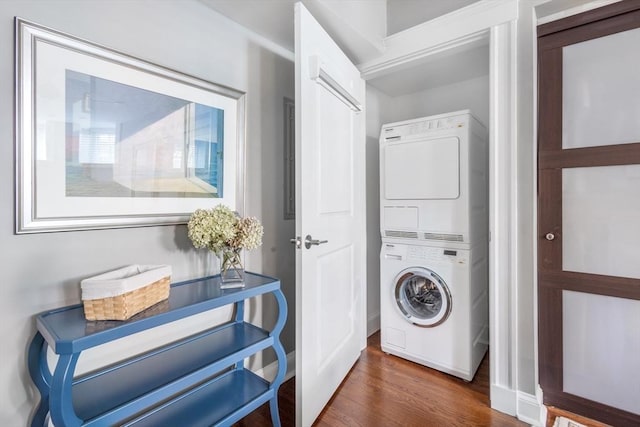 256 W Newton St Unit 1, Boston, MA 02116 - laundry room with estacked washer and dryer and wood finished floors