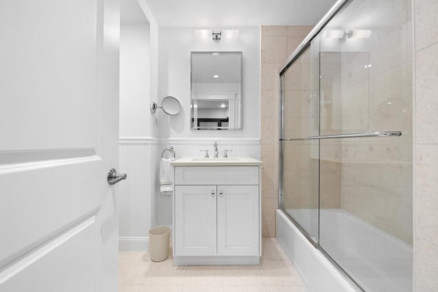 256 W Newton St Unit 1, Boston, MA 02116 - bathroom with vanity, combined bath / shower with glass door, tile patterned floors, and wainscoting