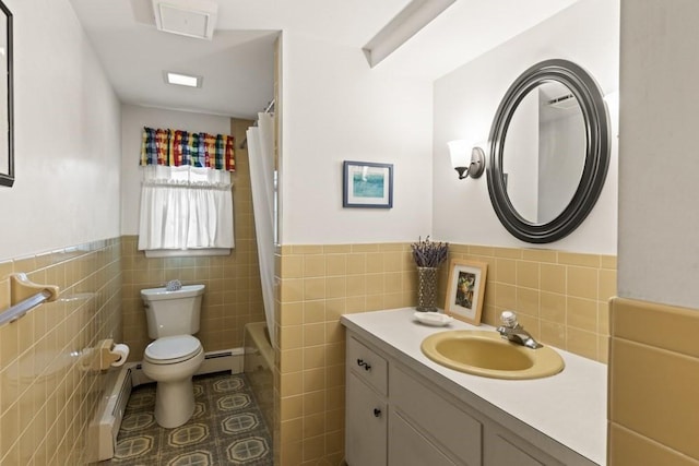 56 Fairwood Rd, Yarmouth, MA 02664 - full bath with toilet, vanity, tile walls, wainscoting, and baseboard heating