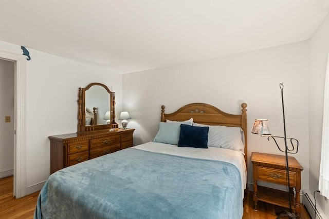 56 Fairwood Rd, Yarmouth, MA 02664 - bedroom featuring a baseboard radiator and light wood-style flooring