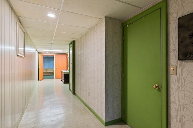 56 Fairwood Rd, Yarmouth, MA 02664 - hall with light floors, wallpapered walls, baseboards, and a drop ceiling
