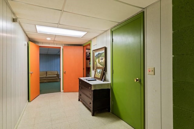 56 Fairwood Rd, Yarmouth, MA 02664 - hallway featuring light floors, wood walls, and a paneled ceiling