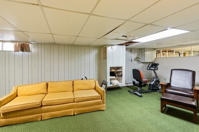 56 Fairwood Rd, Yarmouth, MA 02664 - living room featuring a paneled ceiling, wood walls, and carpet