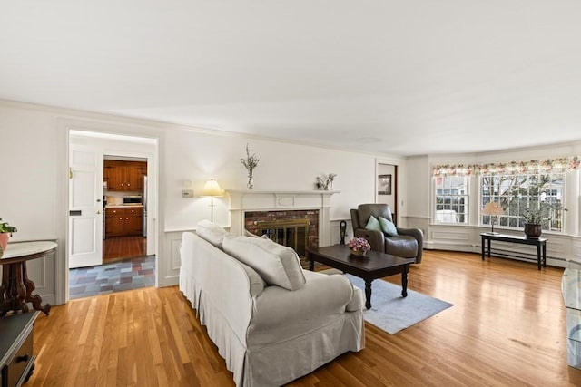 56 Fairwood Rd, Yarmouth, MA 02664 - living area featuring a fireplace and light wood finished floors