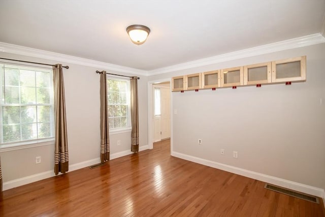 12 Kestrel Ln Unit 7, Westford, MA 01886 - empty room featuring baseboards, ornamental molding, and light wood-style floors