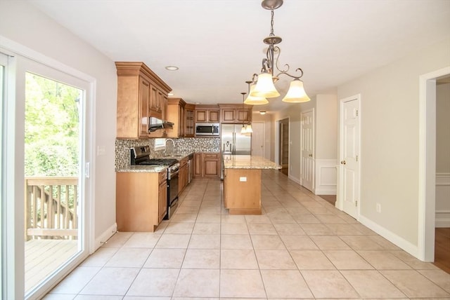 12 Kestrel Ln Unit 7, Westford, MA 01886 - kitchen featuring stainless steel appliances, decorative backsplash, healthy amount of natural light, and a sink