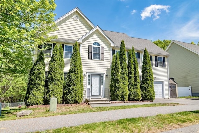 12 Kestrel Ln Unit 7, Westford, MA 01886 - view of front of property with fence, driveway, and a garage