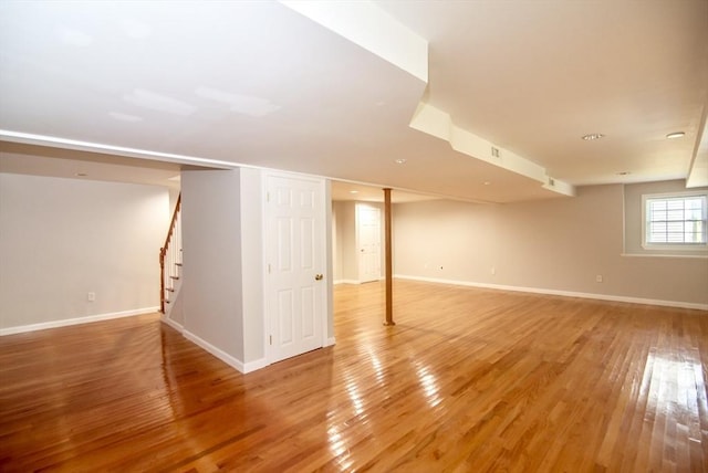 12 Kestrel Ln Unit 7, Westford, MA 01886 - basement featuring light wood-type flooring, stairway, and baseboards