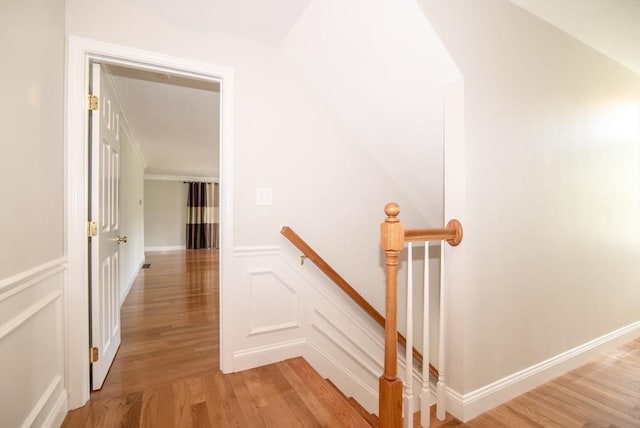 12 Kestrel Ln Unit 7, Westford, MA 01886 - stairs with wood finished floors, a decorative wall, and wainscoting