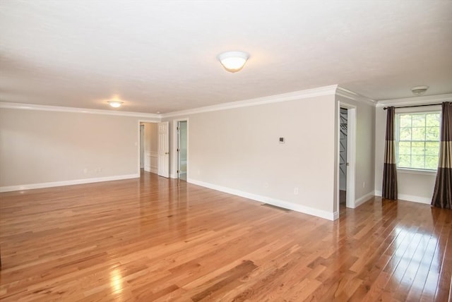 12 Kestrel Ln Unit 7, Westford, MA 01886 - empty room with ornamental molding, light wood-type flooring, and baseboards